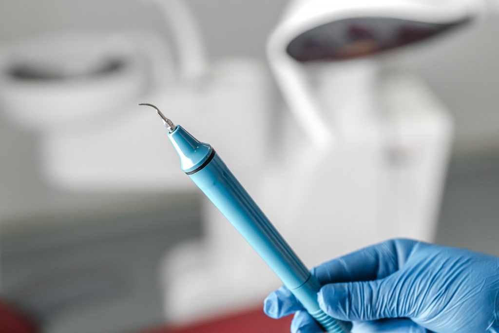 dentist holding a dental endoscope