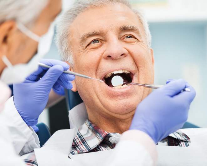 senior man getting dental checkup